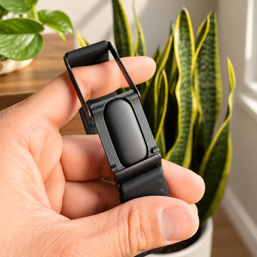 Forato ClipLink adapter held in hand with Fitbit Air and WHOOP band